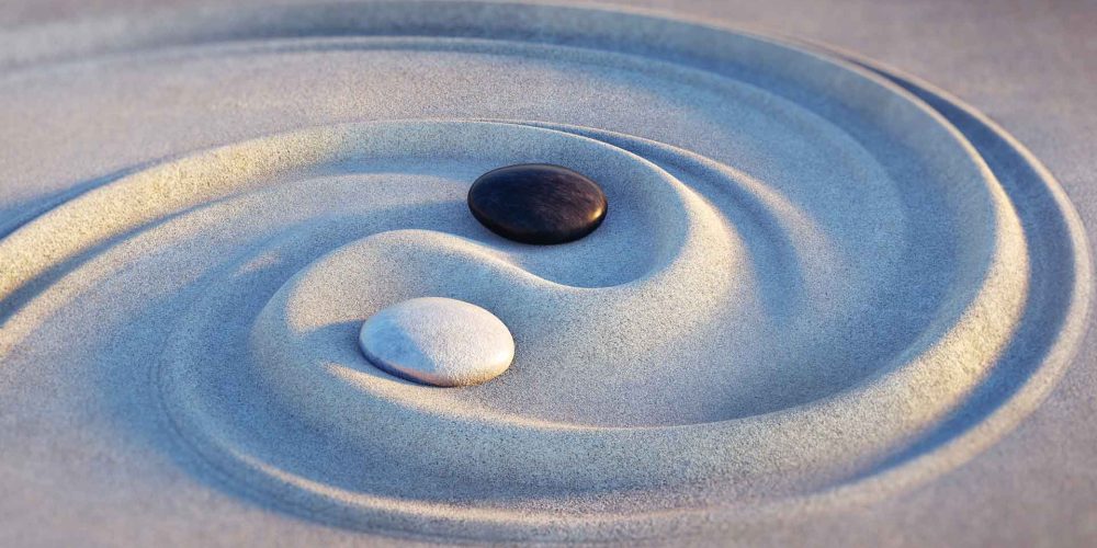 Stones and sand in yin yang pattern